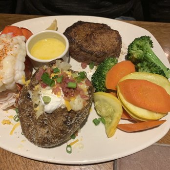Outback Steakhouse - Sirloin and lobster loaded bake potato and steam vegetables - Steakhouses Near Me - Rochester, New York Outback Steakhouse - Sirloin and lobster loaded bake potato and steam vegetables - Steakhouses Near Me - Rochester, New York