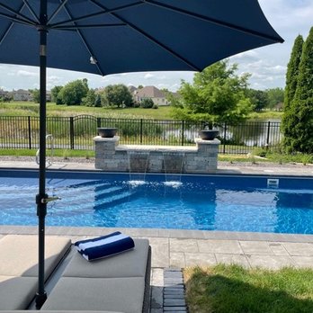 Greengold Landscaping - a pool and patio area - Landscaping Near Me