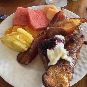 La Hiki - Pineapple, watermelon, bacon, French toast with blueberry compote, whipped cream and lillicoy syrup - Breakfast & Brunch Near Me - Kapolei, Hawaii La Hiki - Pineapple, watermelon, bacon, French toast with blueberry compote, whipped cream and lillicoy syrup - Breakfast & Brunch Near Me - Kapolei, Hawaii