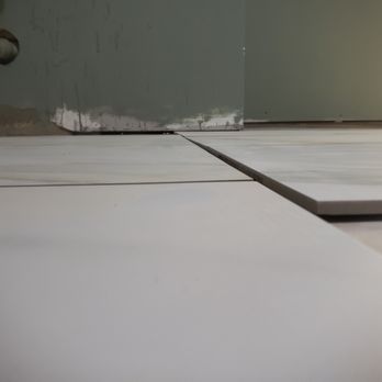 Krisako Construction - uneven after 5 bags of self leveling - General Contractors Near Me