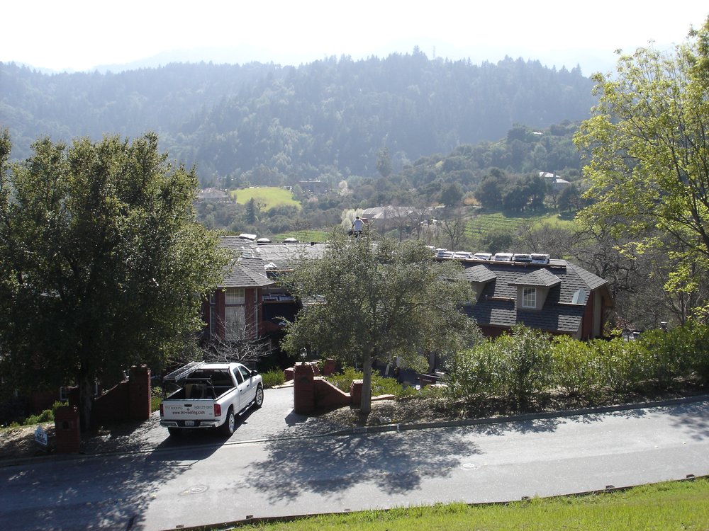 Slide of TNT Roofing