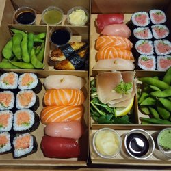 Sushi Kumamoto - Left: Spicy Tuna Rolls, Unagi Right: Negi-Toro Rolls, Albacore Sashimi Both: Bluefin Tuna, Salmon, Hamachi