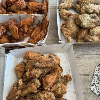 Wingstop - a variety of chicken wings in boxes - Chicken Wings Near Me - Fountain, Colorado