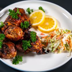Ubuntu Meat Bar & Safari Spice Grill - Tender chicken infused with house spicy Peri Peri flavors, grilled to perfection.