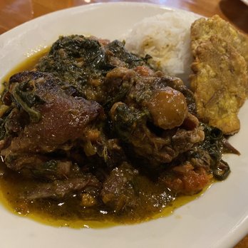 Fritai - Legim Epina - Haitian Smothered Greens with mirliton & spinach greens served with fried green plantains & white rice Braised Oxtail - Haitian Near Me - New Orleans, Louisiana