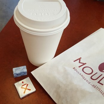 Moulin - My Café au lait was served with a Sugar cube a tiny chocolate. - Cafes Near Me - Laguna Beach, California
