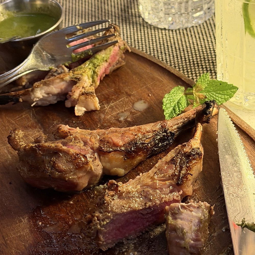 Fogo de Chão - Lamb lollipops post cutting into - Brazilian Near Me - Orlando, Florida Fogo de Chão - Lamb lollipops post cutting into - Brazilian Near Me - Orlando, Florida