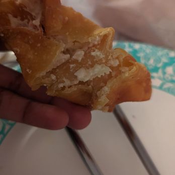Family Fortune - a person holding a pastry with a bite taken out of it - Chinese Near Me - Alexandria, Virginia Family Fortune - a person holding a pastry with a bite taken out of it - Chinese Near Me - Alexandria, Virginia