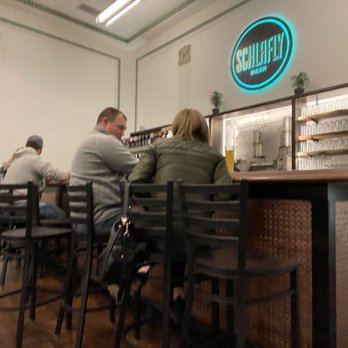 Schlafly Highland Square - Bar at front of dining room - Brewpubs Near Me - Highland, Illinois Schlafly Highland Square - Bar at front of dining room - Brewpubs Near Me - Highland, Illinois