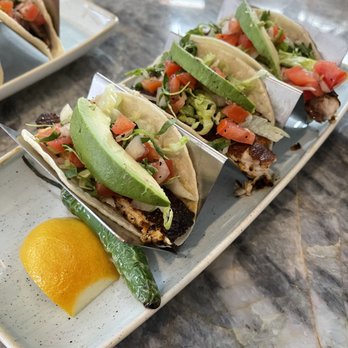 Naranja Tequila And Mezcal Bar - three tacos on a plate with an egg - Hotels Near Me - San Antonio, Texas Naranja Tequila And Mezcal Bar - three tacos on a plate with an egg - Hotels Near Me - San Antonio, Texas