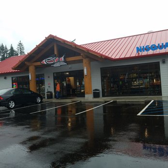 Nisqually Markets - Frederickson Place - a wet parking lot - Gas Stations Near Me - Frederickson, Washington