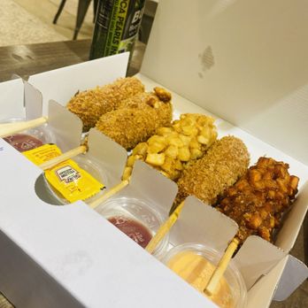 Gold Miss - an open box of food with chopsticks - Hot Dogs Near Me - Fairfax, Virginia Gold Miss - an open box of food with chopsticks - Hot Dogs Near Me - Fairfax, Virginia