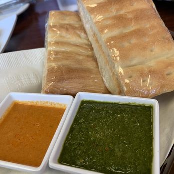 Aria-Afghan Restaurant - Green sauce (Chatni) and a spicy sauce that pairs well with the Potato Bolani... and everything else lol - Afghan Near Me - North Highlands, California Aria-Afghan Restaurant - Green sauce (Chatni) and a spicy sauce that pairs well with the Potato Bolani... and everything else lol - Afghan Near Me - North Highlands, California