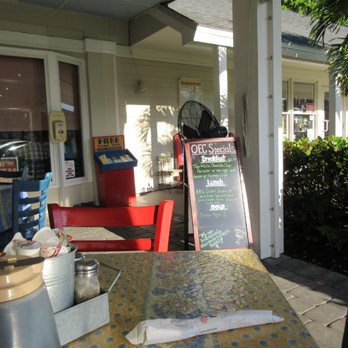 Over Easy Cafe - View of specials sign board in outdoor dining area - Breakfast & Brunch Near Me - Sanibel, Florida