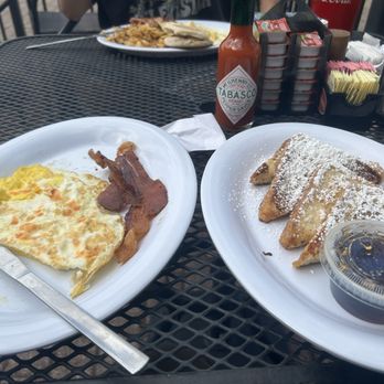 Dwyer's Cafe - Breakfast #5 with bacon and French toast with loads of syrup and tobasco sauce - Cafes Near Me - Lafayette, Louisiana