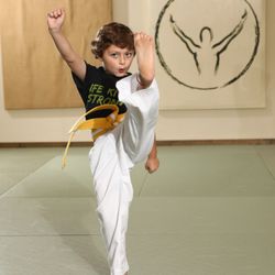 Life Ki-do Martial Arts & Personal Development - South Austin Ninja Boy Kicking