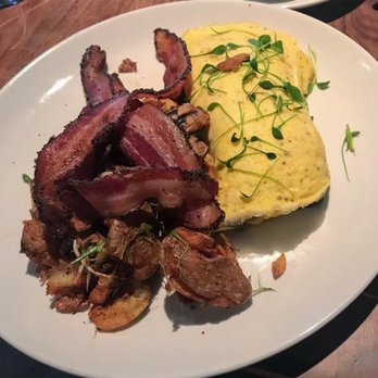 Eleven - Goat cheese omelette with a side of black pepper bacon and CRISPY fingerling potatoes - New American Near Me - Pittsburgh, Pennsylvania Eleven - Goat cheese omelette with a side of black pepper bacon and CRISPY fingerling potatoes - New American Near Me - Pittsburgh, Pennsylvania