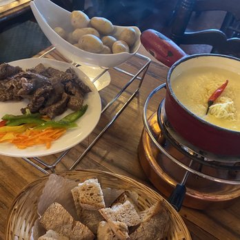 FONDUE HOUSE DU PONT - Potatoes and bread came with our fondue. Beef and tiny veggies were ala carte. - Swiss Food Near Me - Luzern, LU FONDUE HOUSE DU PONT - Potatoes and bread came with our fondue. Beef and tiny veggies were ala carte. - Swiss Food Near Me - Luzern, LU