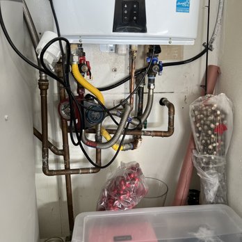Lowrey Family Plumbing - Tankless heater nightmare 'before' and incorrect discharge (corroded) pipe material. - Plumbing Near Me Lowrey Family Plumbing - Tankless heater nightmare 'before' and incorrect discharge (corroded) pipe material. - Plumbing Near Me