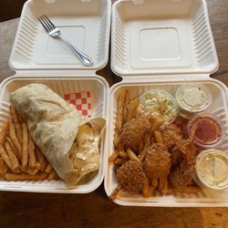 A&H Curbside grill - Grilled chicken taco on the left coconut shrimp with coleslaw on the right
