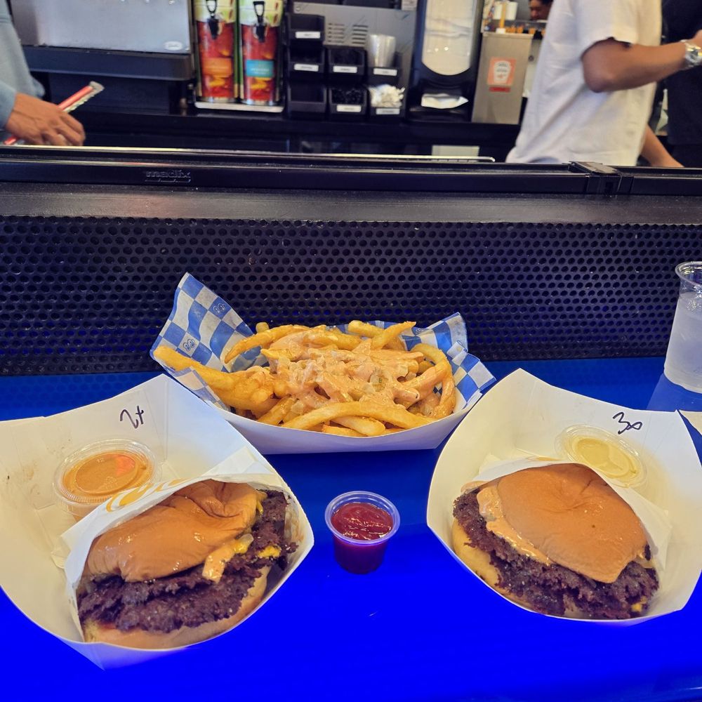 Burger Bodega - Double smash burger with spicy mayo, screwed fries, and a triple smash burger with aioli - Burgers Near Me - Houston, Texas