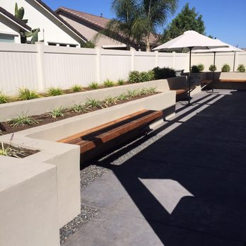 Sutton's Landscape & Maintenance - Raised beds with wooden benches and stamped concrete - Landscaping Near Me Sutton's Landscape & Maintenance - Raised beds with wooden benches and stamped concrete - Landscaping Near Me