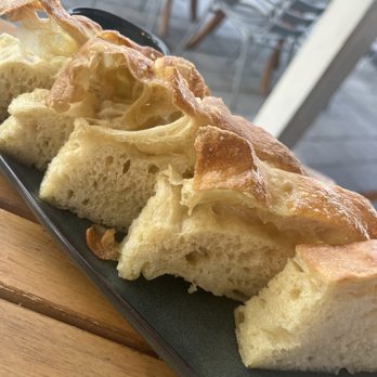 Asado Life - Focaccia with delicious crispy top - New American Near Me - Saint Augustine, Florida Asado Life - Focaccia with delicious crispy top - New American Near Me - Saint Augustine, Florida