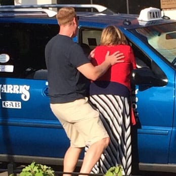 Corner Pub Tavern & Restaurant - a man and a woman embracing in front of a blue van - Pubs Near Me - Valmeyer, Illinois Corner Pub Tavern & Restaurant - a man and a woman embracing in front of a blue van - Pubs Near Me - Valmeyer, Illinois