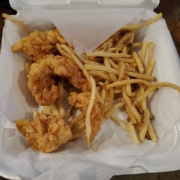a basket of fried chicken and french fries