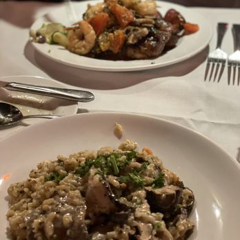 Toscanos - Mushroom risotto and ribeye with prawns. - Italian Near Me - Puyallup, Washington Toscanos - Mushroom risotto and ribeye with prawns. - Italian Near Me - Puyallup, Washington