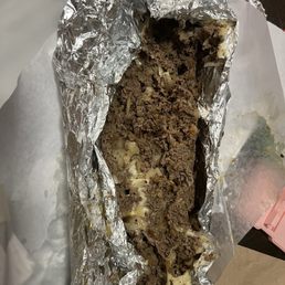 Large cheesesteak packed for travel.