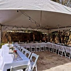 Diamond Events Rentals - 20x20 High Peak Marquee Tent, with rectangular tables and Garden chairs.
