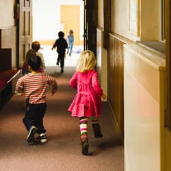 Trinity Church Nursery School - Running to the bikeroom for inside playtime