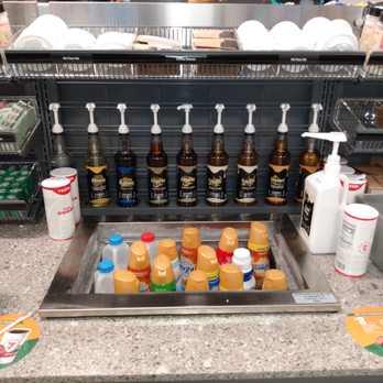 7-Eleven - a counter with a variety of drinks and condiments - Convenience Stores Near Me - Delran, New Jersey
