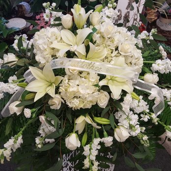 The Magic Garden - All white casket spray - Florists Near Me - Rochester, New York The Magic Garden - All white casket spray - Florists Near Me - Rochester, New York