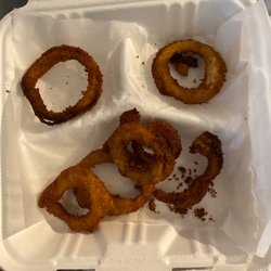 Village Pizza - These are the onion rings i ordered all burnt and very cold like they have been sitting out