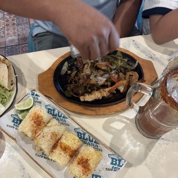Blue Iguana - Chicken and shrimp fajitas with elote - Mexican Near Me - Baton Rouge, Louisiana