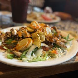 La Hacienda Mexican Restaurant - Chicken fajita with sautéed squash and a variety of veggies on a bed of lettuce.