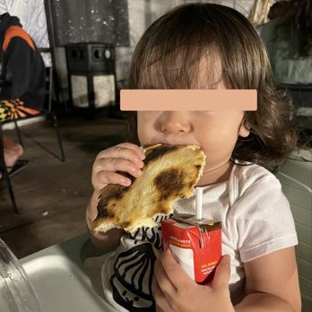 Mad Pie - My 1 year old scarfing down a piece! - Pizza Near Me - Honolulu, Hawaii