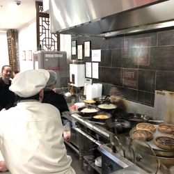 Shanghai Fried Dumpling - You can watch them fold dumplings and cook through the glass window at the front.
