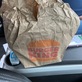 Burger King - a brown paper bag on the seat of a car - Burgers Near Me - Casselberry, Florida