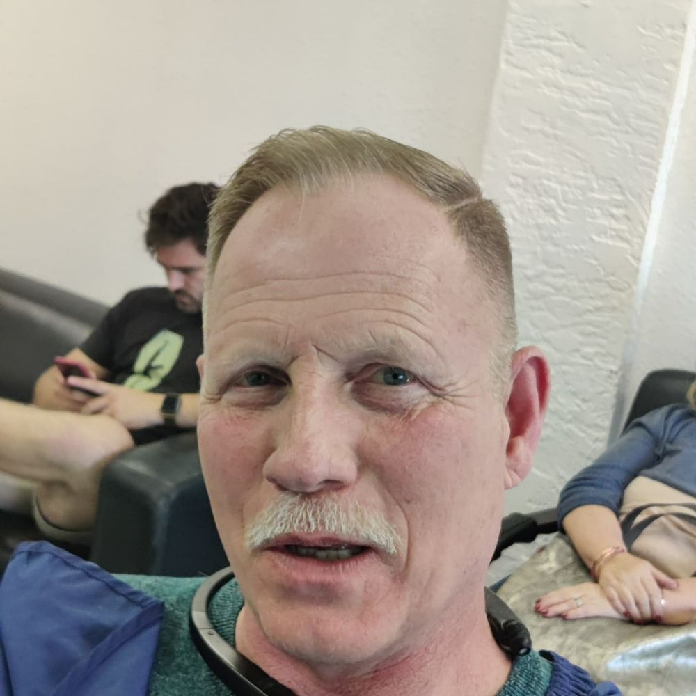 Man In The Mirror Barber Parlor Logo