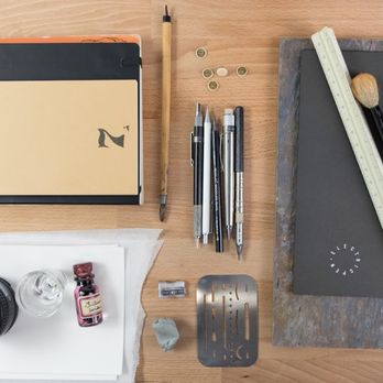 Electric Pen - Creative workspace with drawing tools, ink, and camera lens, showcasing an Electric Pen designer's organized and artistic environment. - Web Design Near Me - Seattle, Washington Electric Pen - Creative workspace with drawing tools, ink, and camera lens, showcasing an Electric Pen designer's organized and artistic environment. - Web Design Near Me - Seattle, Washington
