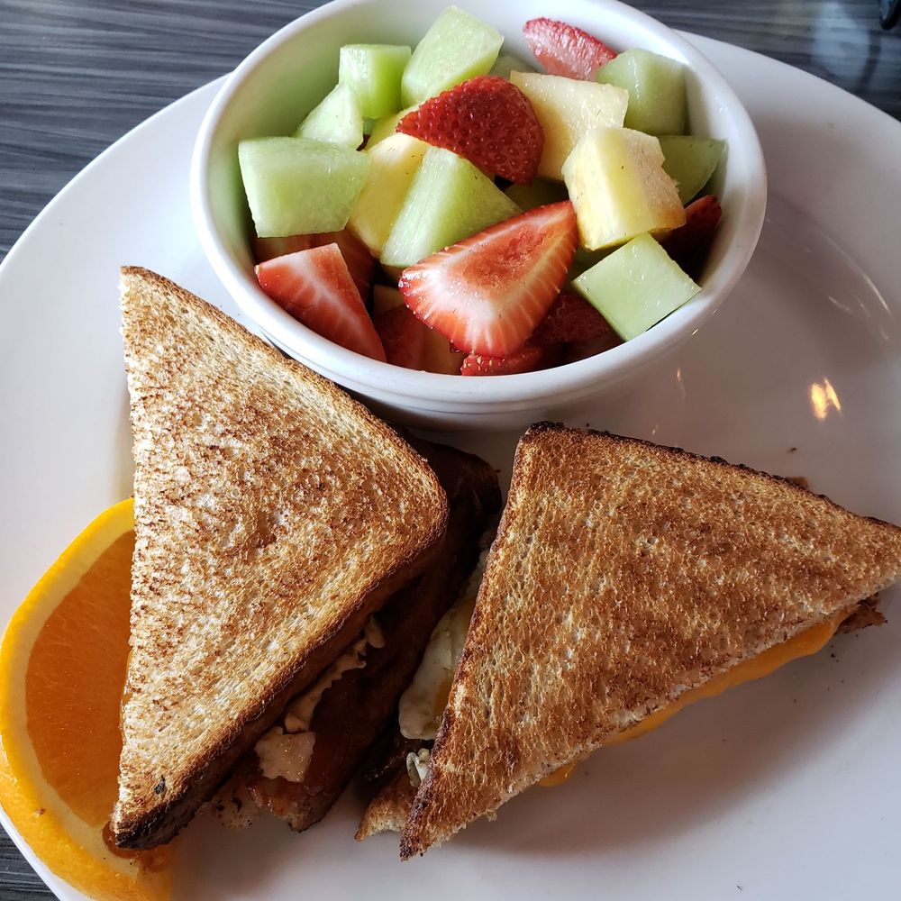 Refinery Grill - The bacon cheese and egg breakfast sandwich with added fruit. - Delis Near Me - Edmonton, Alberta Refinery Grill - The bacon cheese and egg breakfast sandwich with added fruit. - Delis Near Me - Edmonton, Alberta