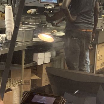 Taco Bell - a man cooking in a restaurant kitchen - Fast Food Near Me - Rehoboth Beach, Delaware Taco Bell - a man cooking in a restaurant kitchen - Fast Food Near Me - Rehoboth Beach, Delaware