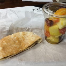 Sausage pita and fresh fruit.