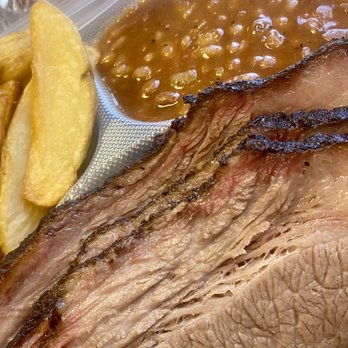 Railroad Bbq - The Conductor Texas Style Slow Smoked Beef Brisket. We chose the baked beans and potato wedges as our sides. - Barbeque Near Me - Columbia, South Carolina