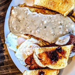 Little Gallea Restaurant - German sausage, eggs over easy, hash browns and gravy with sourdough toast.