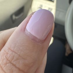 Sunset Glow Nail Spa - Gel "Manicure" that looks like it's been grown out for 2 weeks. Bubbles, an uneven cuticle and not painted to the cuticle line.