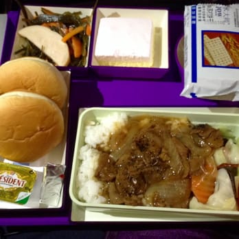 China Southern Airlines - 1 of 2 in flight meals from Guanghzou, China to LA.  Pepper beef w/ rice, veggie, bread, crackers, seaweed salad & a whipped cream cake. - Airlines Near Me - Pasay, NCR